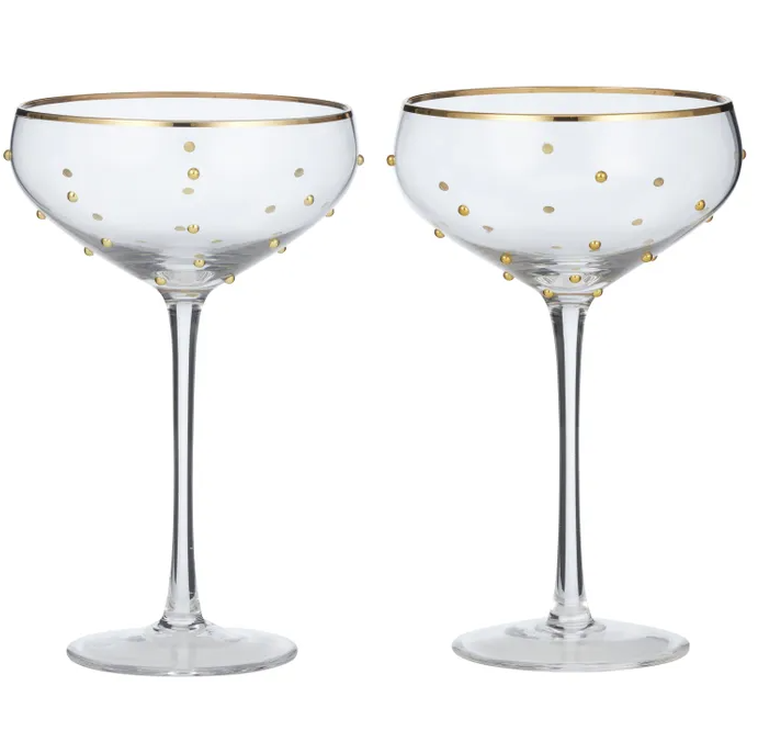 Set of two clear coupe glasses with gold polka dots and gold rim, ideal for champagne or cocktails, adding elegance to any table setting.