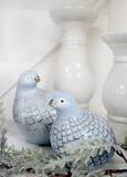 Porcelain guinea fowl ornament in soft blue with crackle glaze and feather detailing.