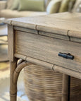 Hampshire console table in light walnut styled in coastal living room setting
