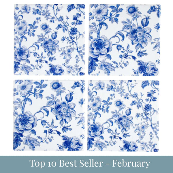 Set of four square ceramic coasters with blue and white floral botanical pattern arranged in a grid with top 10 best seller - february overlay