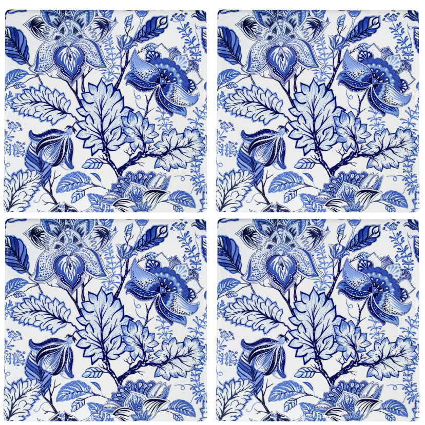 Set of four blue and white floral ceramic coasters with hand-painted design and cork backing.