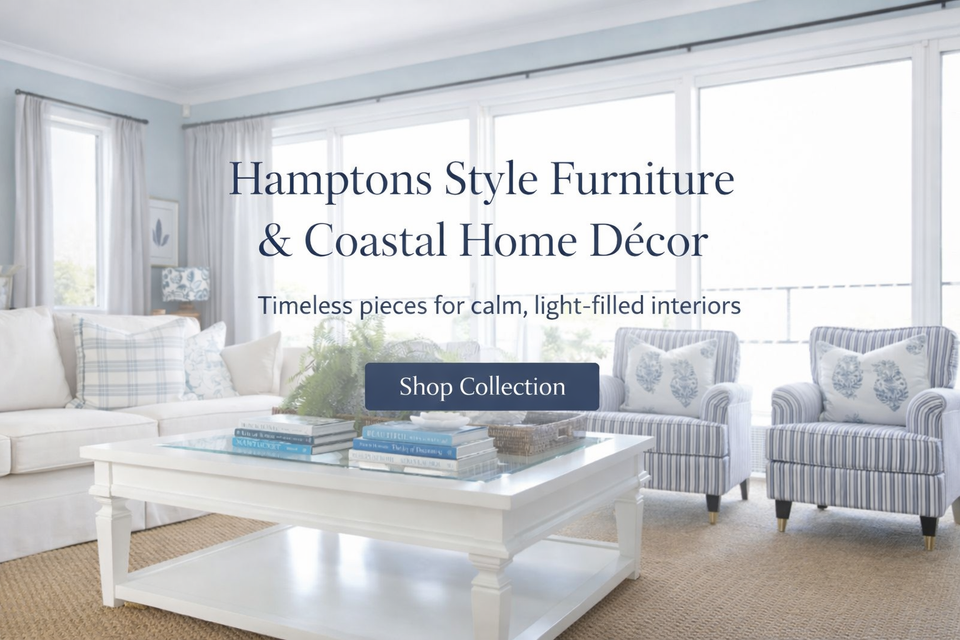 Hamptons style furniture and coastal home decor in a light-filled living room with blue and white cushions