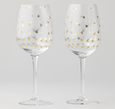 Set of two clear wine glasses with metallic gold honey bee pattern, elegant stemmed glassware for entertaining.