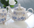 Hydrangea Blooms teapot styled with matching floral mugs on white side table