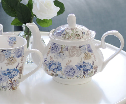 Hydrangea Blooms teapot styled with matching floral mugs on white side table