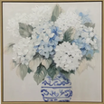Textured canvas wall art featuring white and blue hydrangeas in a classic blue-and-white vase, framed and styled in a Hamptons-inspired interior.