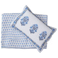 Cotton coverlet set showing reversible blue floral hand block print and coordinating pillow shams