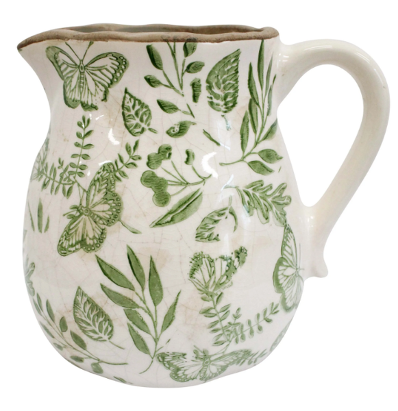 Medium ceramic jug with green butterfly and foliage design on an off-white base, 16x13x15.5cm.