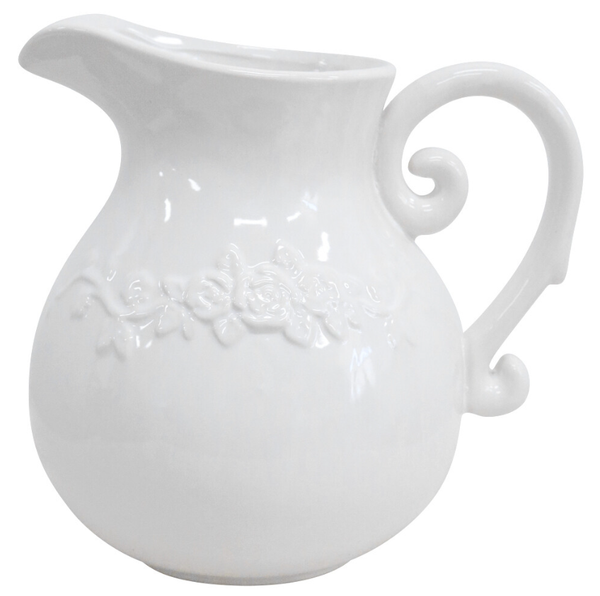 A glossy white ceramic pitcher or jug with a round belly and a wide handle. It features a raised, unpainted floral design (roses and leaves) embossed horizontally around the centre of the body.