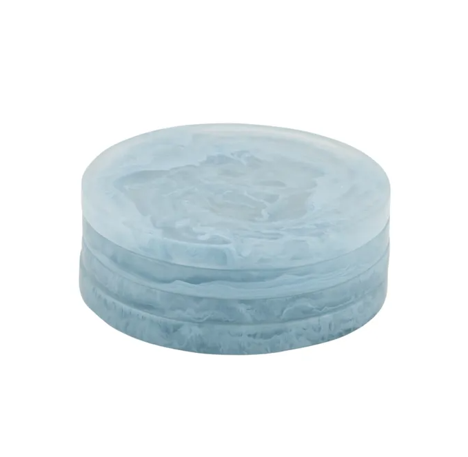 Sky blue resin coasters with a soft marbled finish, stacked in a set of four