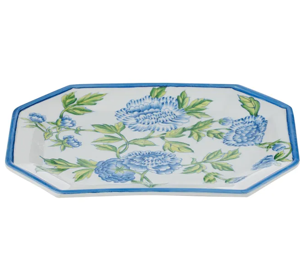 A rectangular ceramic platter with an octagonal shape and a thin blue painted rim. The platter is decorated with a hand-painted blue floral and green vine pattern on a white background.