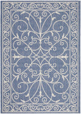 Blue and ivory flatweave outdoor rug featuring an elegant scroll pattern.