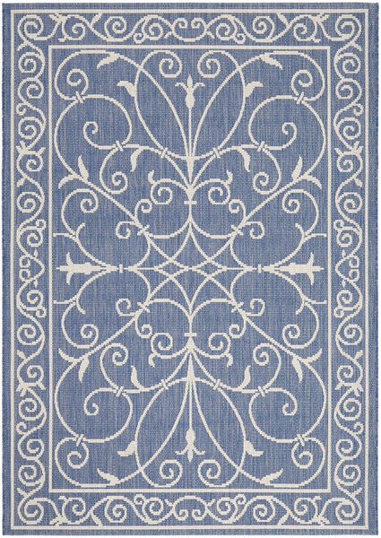 Blue and ivory flatweave outdoor rug featuring an elegant scroll pattern.