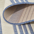 Close-up of the Malibu Coastal Stripe Outdoor Rug Blue showcasing wide and narrow blue coastal stripes.