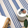 Malibu Coastal Stripe Outdoor Rug Blue creating a relaxed Hamptons outdoor entertaining space.