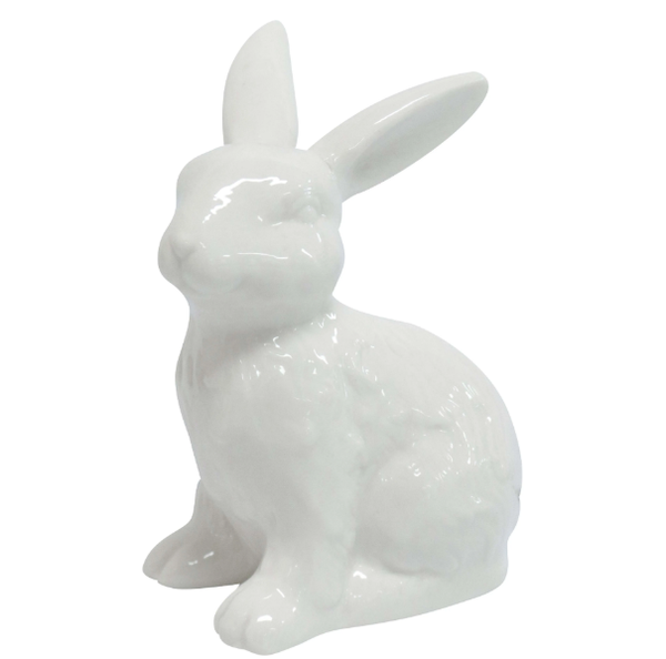 Glossy white ceramic rabbit ornament with upright ears on a white background