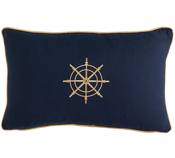 Navy lumbar cushion with embroidered gold ship’s wheel and contrast piping.