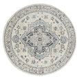 Newport Blue Rug with detailed medallion design in soft blue and ivory tones.