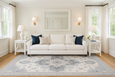 Newport Blue Rug with detailed medallion design in soft blue and ivory tones in a hamptons style classic living room.