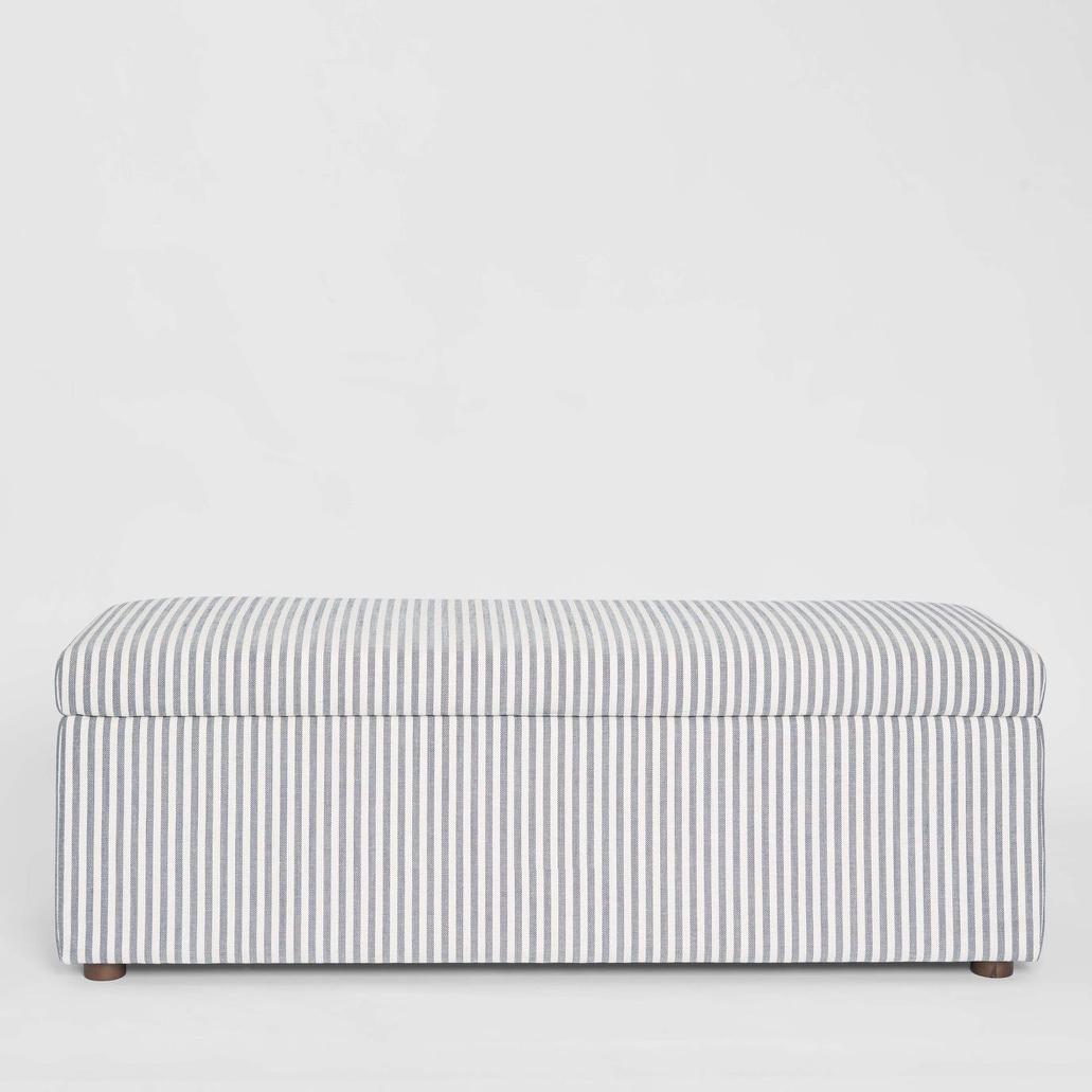 Newport Storage Ottoman upholstered in white and blue pin stripe fabric with timber feet