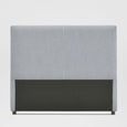 Newport King Bedhead upholstered in white and blue pin stripe fabric behind a made bed