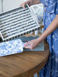 Nya Inlay Tray Navy/Ivory being held with other trays