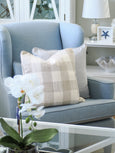 Harlow Cushion Natural – square beige cushion with textured slub fabric and piped edges, 50x50cm Hamptons-style décor on armchair 