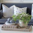 Posey Blue Floral Cushion 45cm with petite blue flowers on white, supplied with feather insert styled on a navy blue sofa with a silver grey ticking stripe cushion