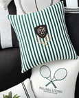 Paloma Tennis Stripes Cushion 55cm in green-and-white cotton stripes with embroidered tennis racquets and PLH crest motif with other cushions in range.