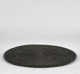 Black round rattan placemat with tight woven texture, 33cm diameter