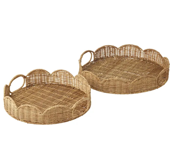 Set of two round natural rattan trays with scalloped edges and woven handles