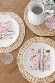 Pink hydrangea lunch napkin with floral pattern, blue and white paper napkin for coastal table setting