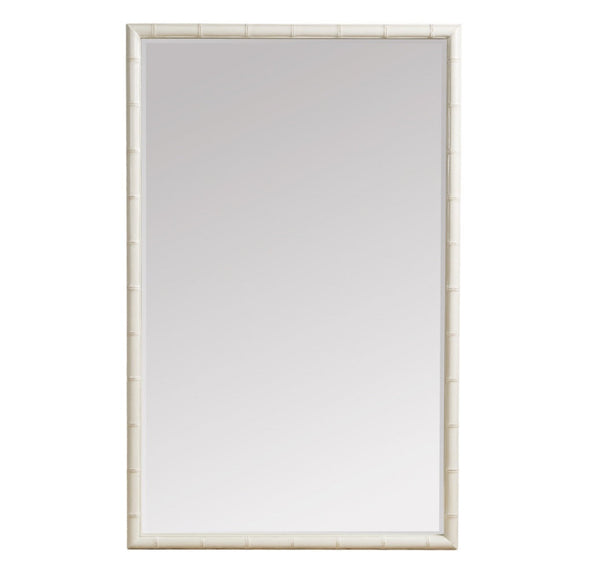 A tall, rectangular mirror with a wide, decorative frame. The frame is finished in a soft off-white and features a raised, textured pattern that resembles bamboo or rattan rods running vertically.