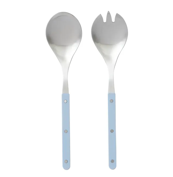 A pair of modern salad servers made of stainless steel. The handles are flat and have a textured, denim-blue finish, while the spoon and fork ends are polished silver metal. The servers are shown side-by-side on a white background.