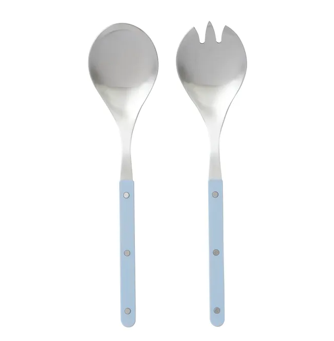 A pair of modern salad servers made of stainless steel. The handles are flat and have a textured, denim-blue finish, while the spoon and fork ends are polished silver metal. The servers are shown side-by-side on a white background.