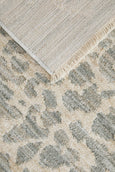 Corner view of Rogue Mist runner rug showing low pile finish, fringe edge, and backing