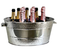 Polished stainless steel oval champagne bucket with dotted double-border design, filled with champagne bottles, perfect for entertaining.