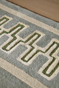 Sanderson Linnean Porcelain Rug with jade and flax geometric border