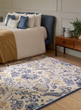 Sanderson Shalimar China Blue Rug with hand-tufted floral tree-of-life design in blue and gold tones