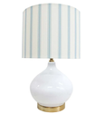 Bayville Lamp with rounded white glass base, gold detailing, and striped blue and white linen shade.
