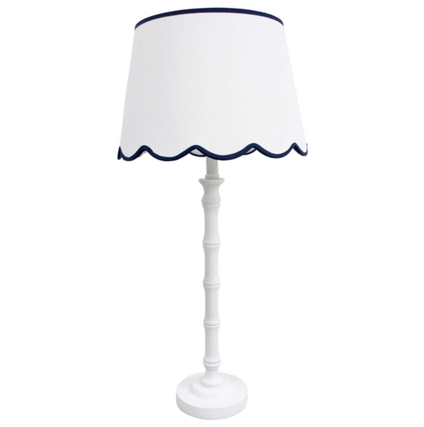 Brunswick Lamp White with scalloped linen shade and tall white polyresin base.