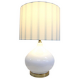 Bayville Lamp with rounded white glass base, gold detailing, and striped blue and white linen shade.