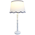 Brunswick Lamp White with scalloped linen shade and tall white polyresin base.
