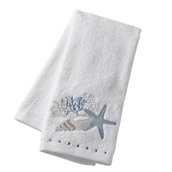 Seaside Hand Towel in soft white cotton with embroidered seashell, coral, and starfish motif.