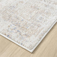 Serenity Ivory Textured Rug with soft distressed ivory and beige pattern and subtle blue accents.