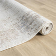 Serenity Ivory Textured Rug with soft distressed ivory and beige pattern and subtle blue accents.