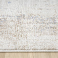 Serenity Ivory Textured Rug with soft distressed ivory and beige pattern and subtle blue accents.