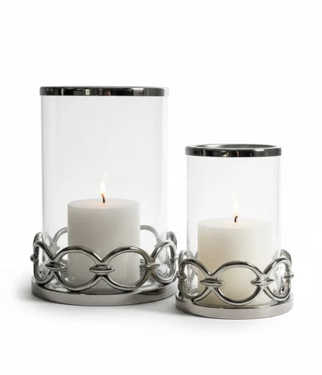 Small silver hurricane candle holder with round link metal base and clear glass cylinder, shown on a white background