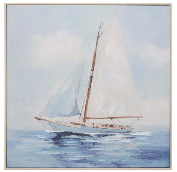 Coastal sailboat artwork in soft blue tones framed in a square canvas