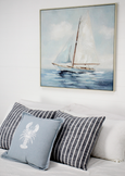 Solo Sailing framed canvas styled above a bed in a Hamptons bedroom